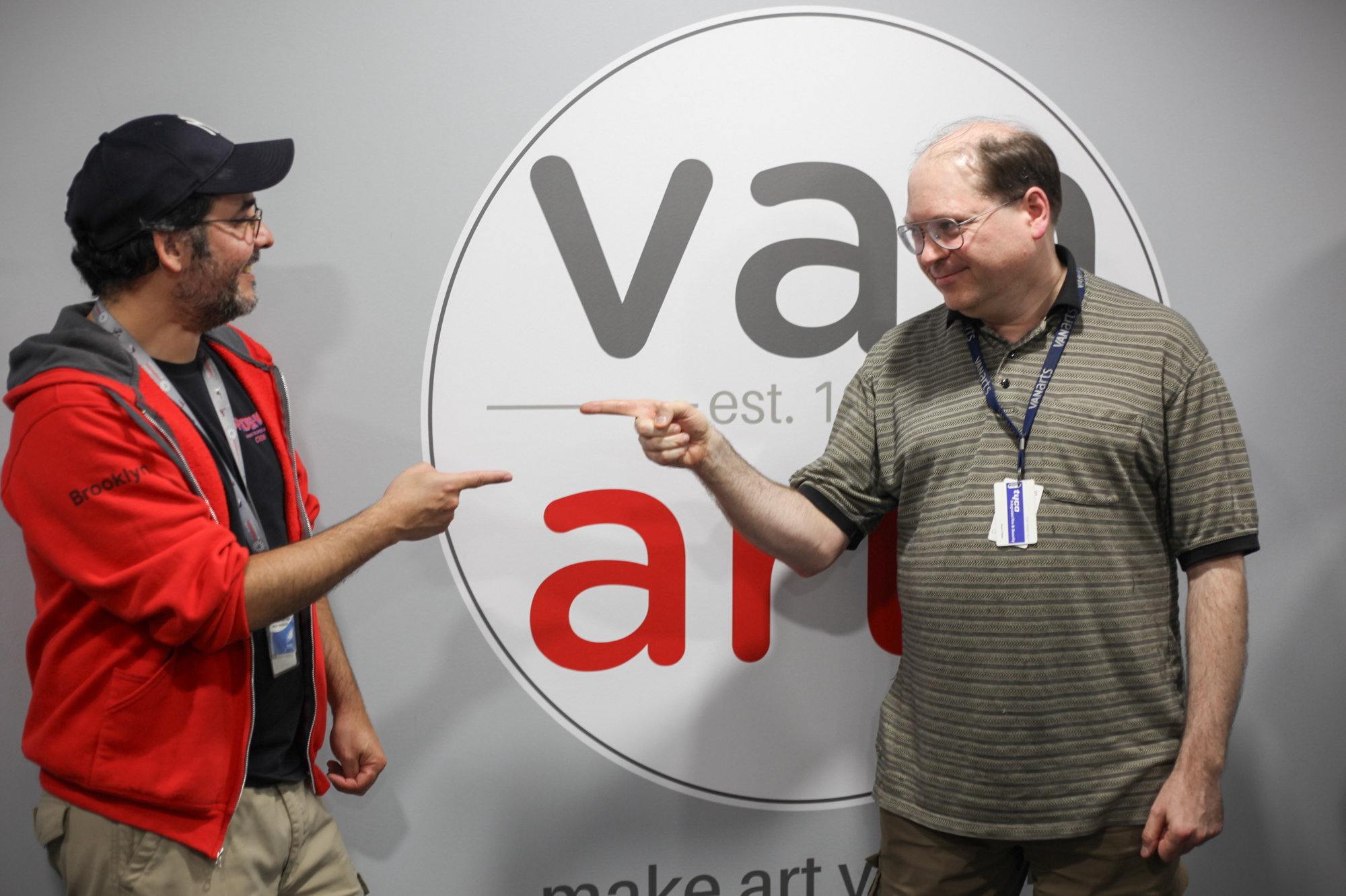 Sam Rico and Charles Phillips, recreating the Spider-Man pointing at Spider-Man meme