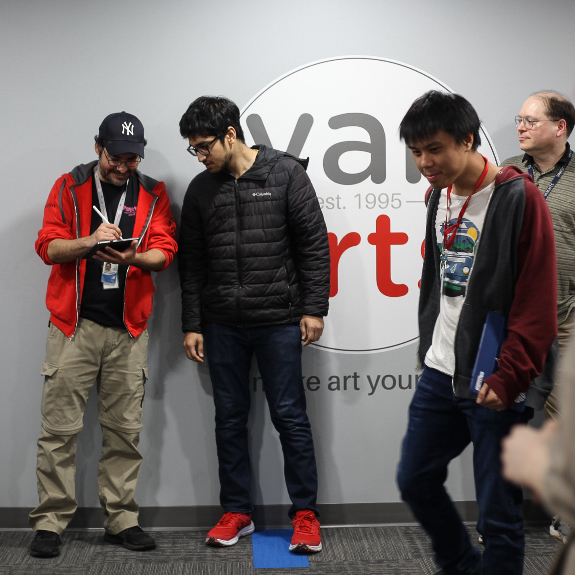 Sam Rico signing autograph for a VanArts Character Animation student